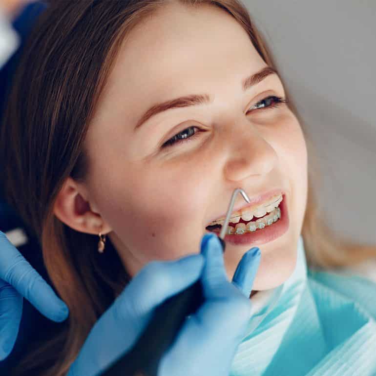 Girl Receiving Orthodontic Treatment in Cairns Dental Clinic