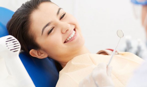 Woman receiving dental treatment from Cairns dentist