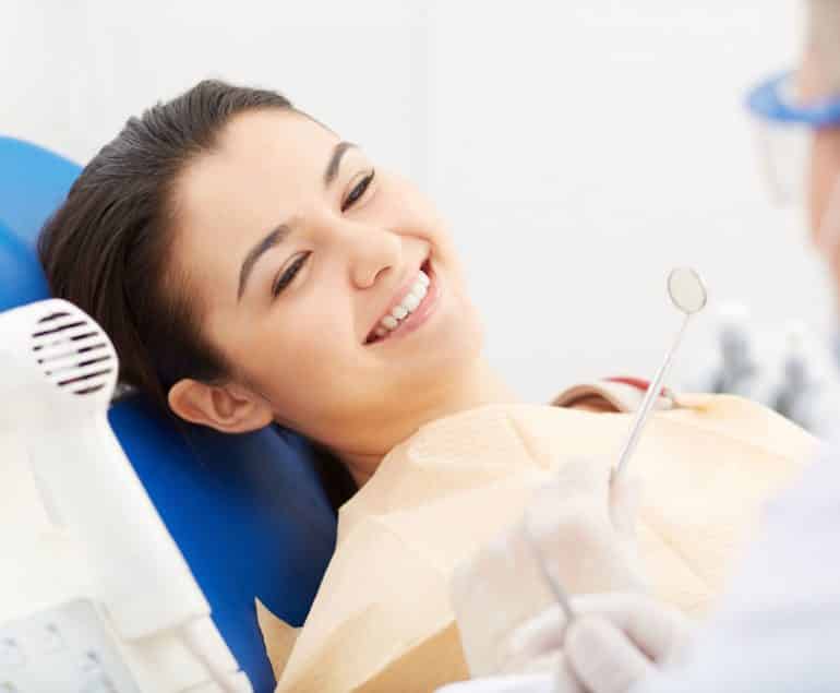 Woman receiving dental treatment from Cairns dentist