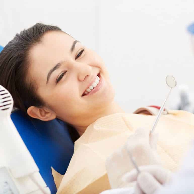 Woman receiving dental treatment from Cairns dentist